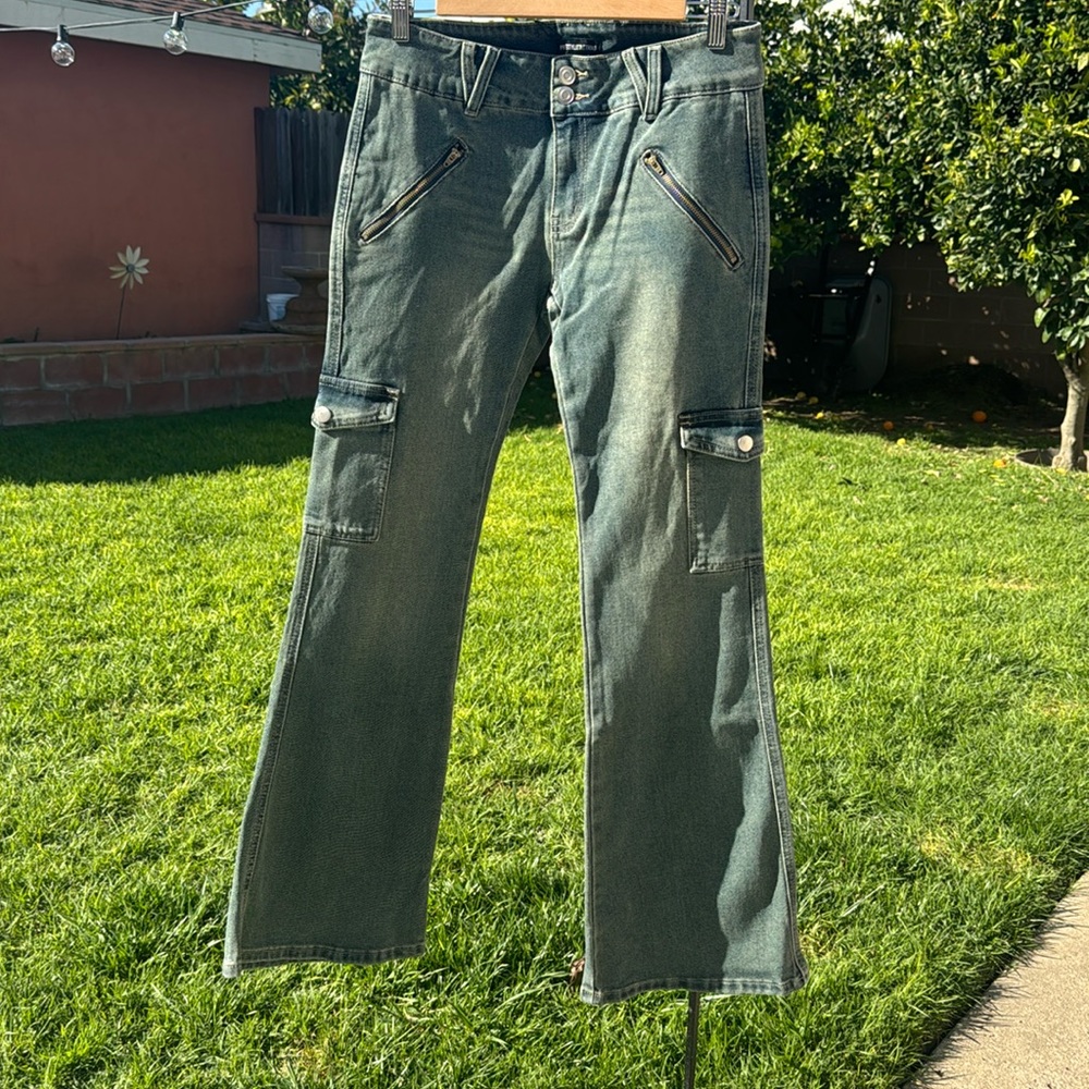A blue washed Jean, Size 4 Women, low waist but wide in the leg.